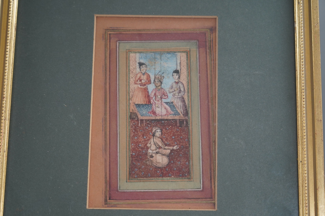 19th century Indian School in Moghul style, watercolour on card, Nobleman and attendants, 11 x 5cm, overall visible sheet 17 x 10.5cm. Condition - fair